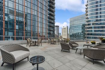 rooftop terrace and social gathering area with comfortable seating at Via Seaport apartments