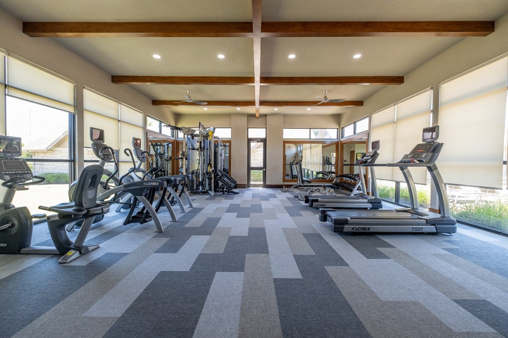 fitness center with cardio equipment at The Pradera apartments