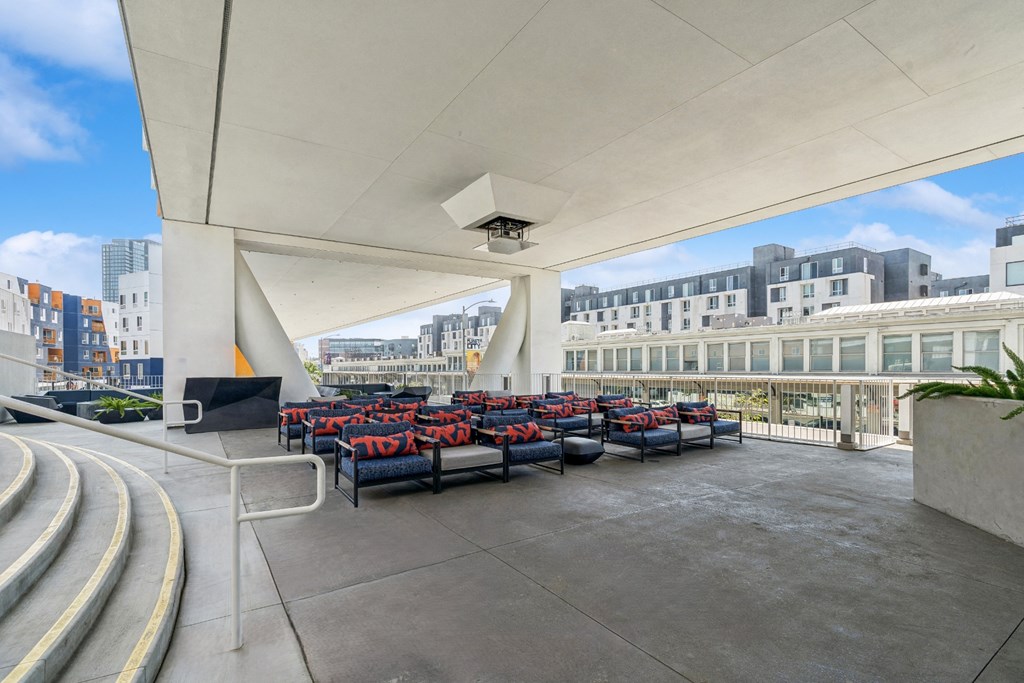 Covered patio and outdoor movie theater at One Santa Fe apartments
