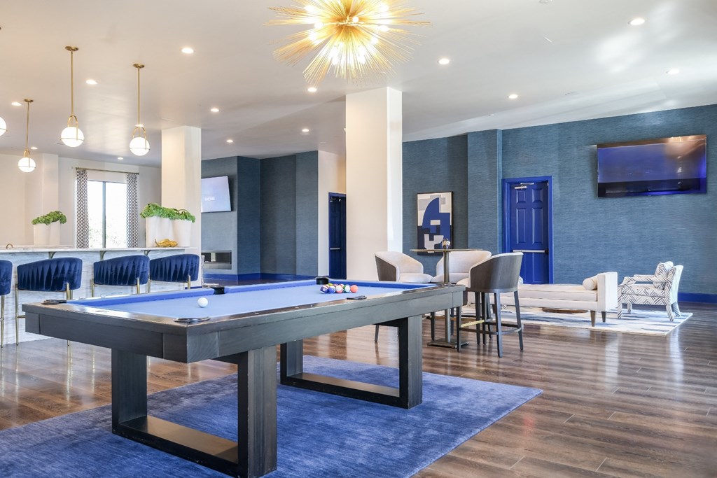 social lounge with billiards at Reveal on the Lake apartments