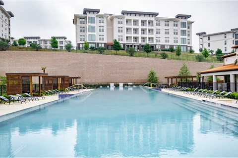 A large indoor swimming pool with a long rectangular shape.