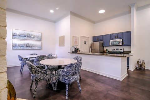 resident social area with a kitchen and dining area at San Marin apartments