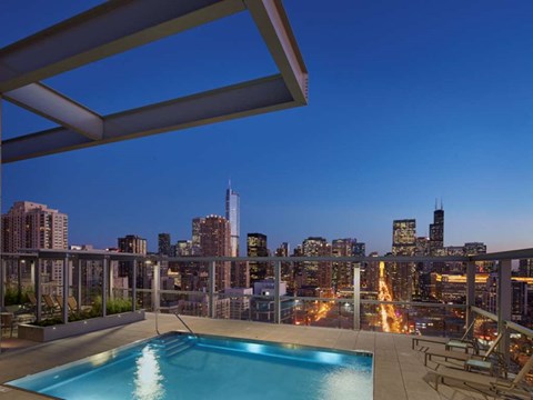 Lit Swimming Pool at Night at 805 N. Lasalle Drive Apartments
