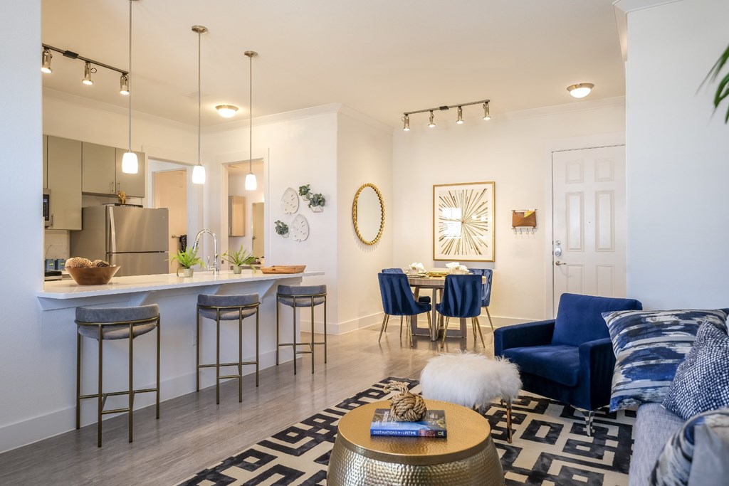 spacious, open-concept kitchen and living area at Reveal on the Lake apartments