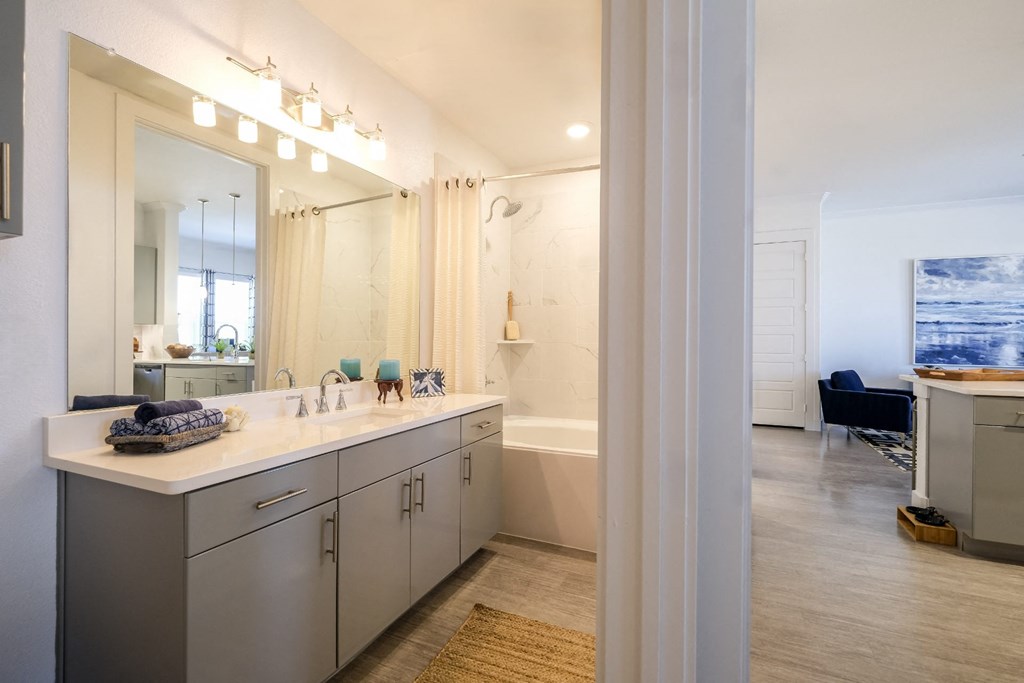 spacious bathroom at Reveal on the Lake apartments