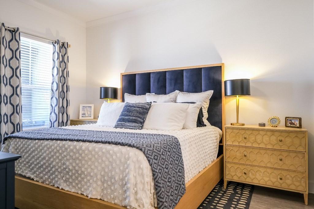 spacious bedroom at Reveal on the Lake luxury apartments