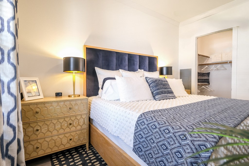 spacious bedroom at Reveal on the Lake luxury apartments in Rowlett, TX