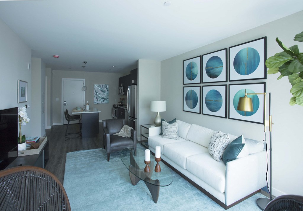 Modern Living Room With Kitchen View at Via Seaport Residences, Boston Seaport, Massachusetts