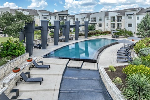swimming pool and sun deck lounging areas at The Allure apartments
