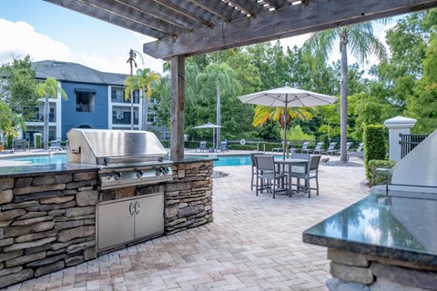 an outdoor grilling station at Verano apartments