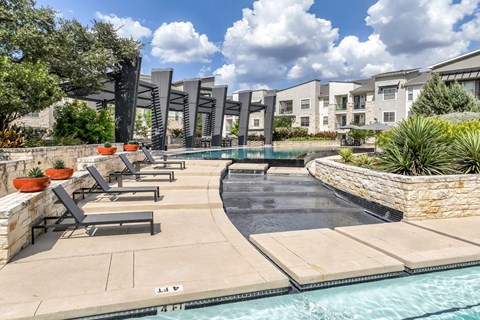 poolside sun deck lounging area at The Allure apartments