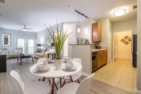 a dining room and living room at Verano apartments