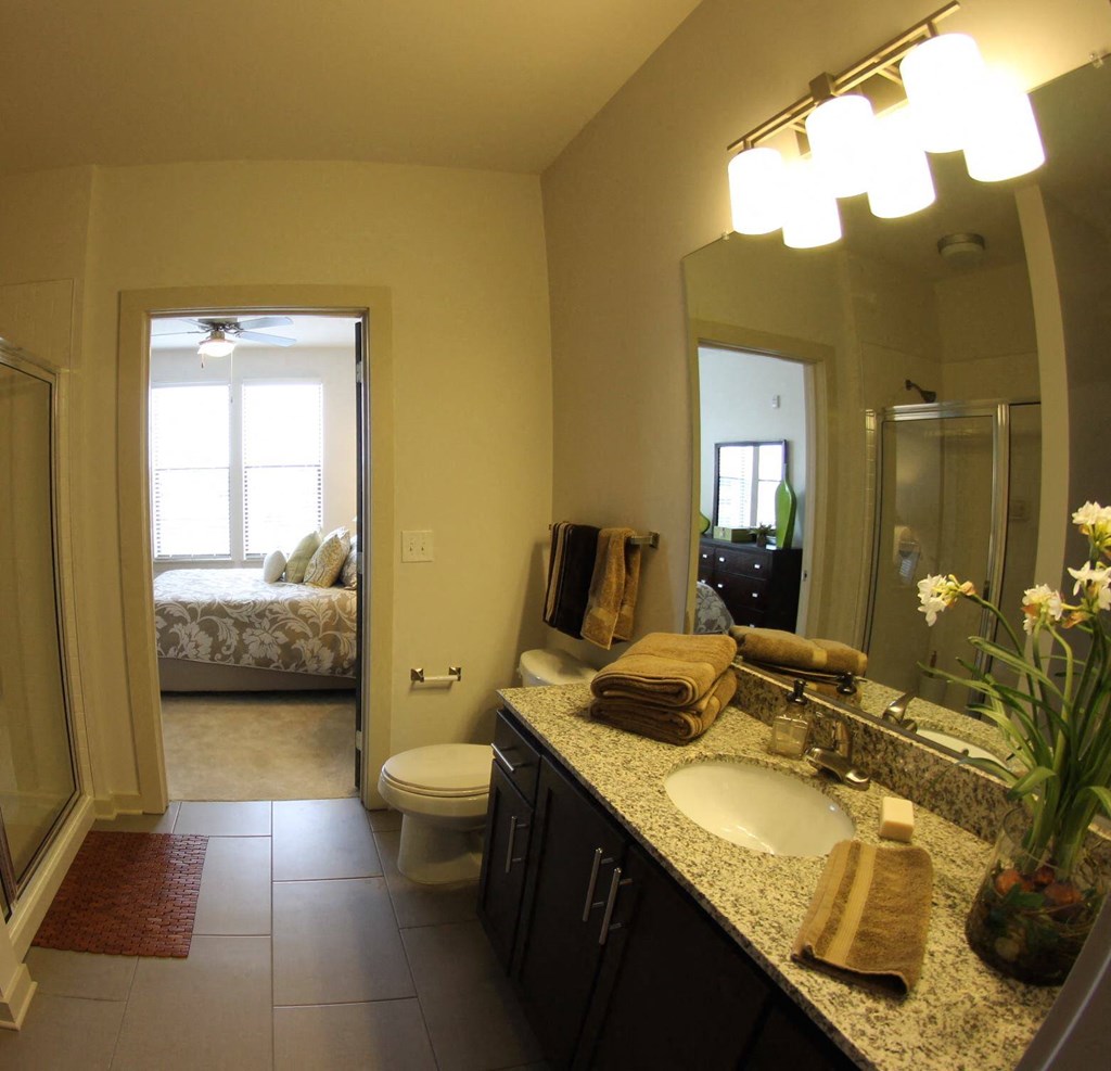 Bath with granite and tile flooring at Artisan on 18th, Tennessee, 37203