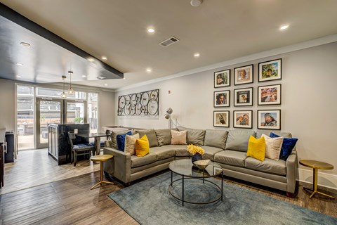 A living room with a grey couch and a coffee table.