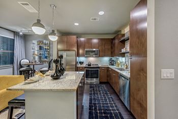 Kitchen Bar With Granite Counter Top at Berkshire Auburn, Texas