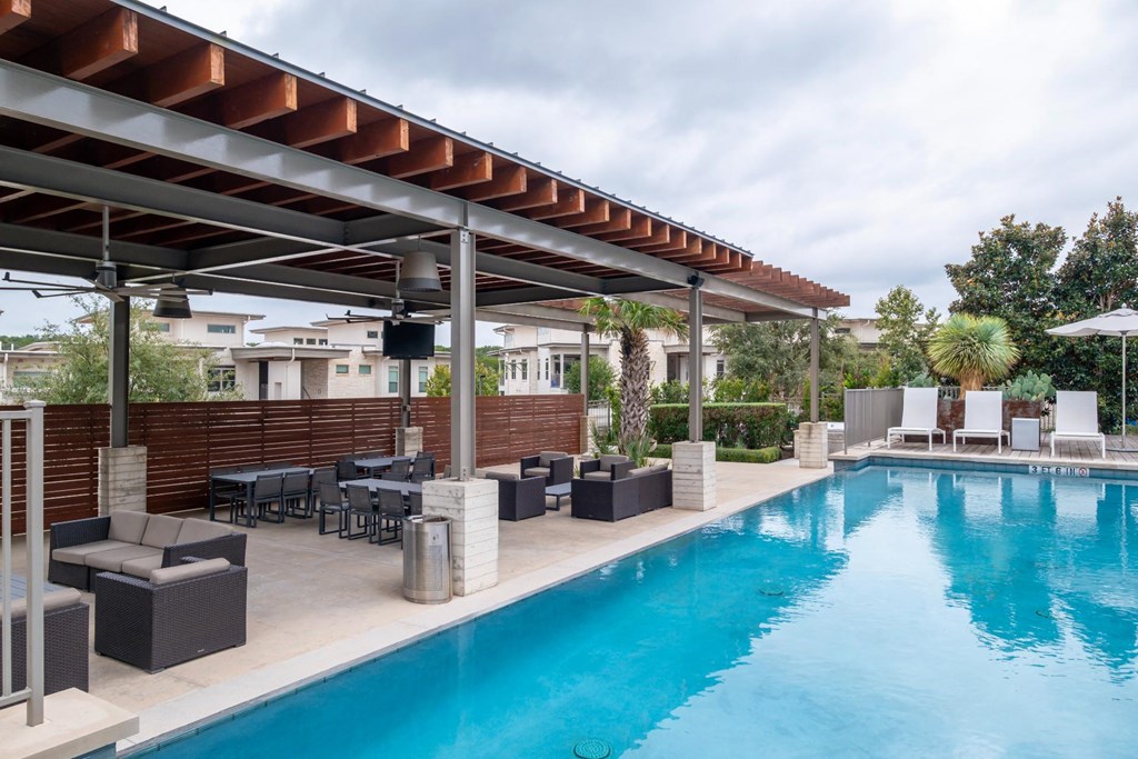 the swimming pool and outdoor lounging areas at Berkshire Santal apartments