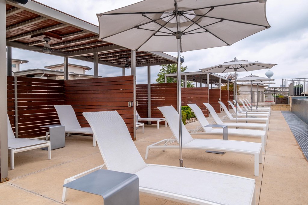 The sun deck with chaise lounge chairs at Berkshire Santal apartments