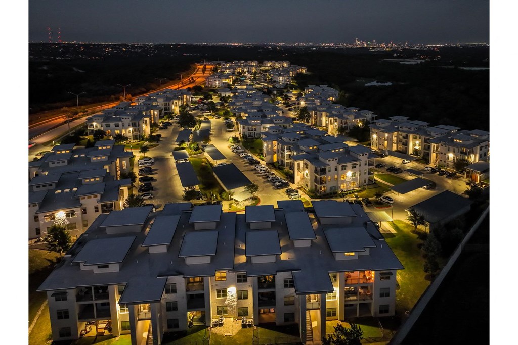 an aerial night-time view of Berkshire Santal apartments in Austin, TX