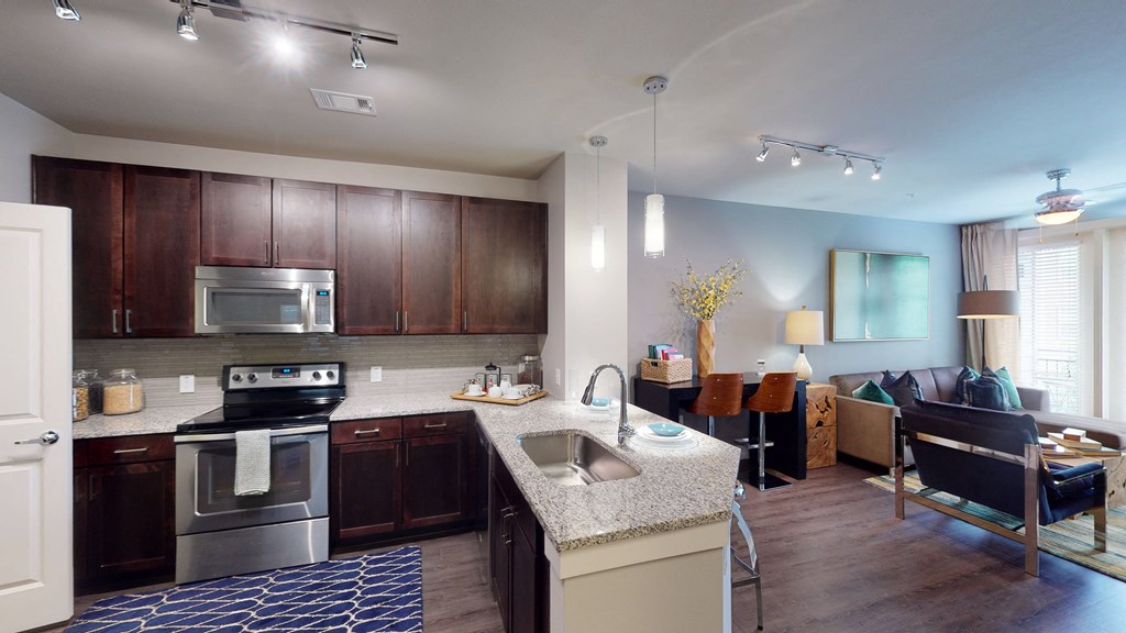 a kitchen and living room in a 555 waverly unit
