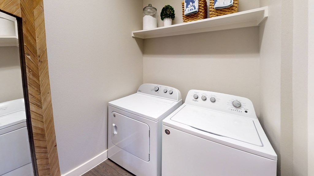 the laundry room has a washer and dryer