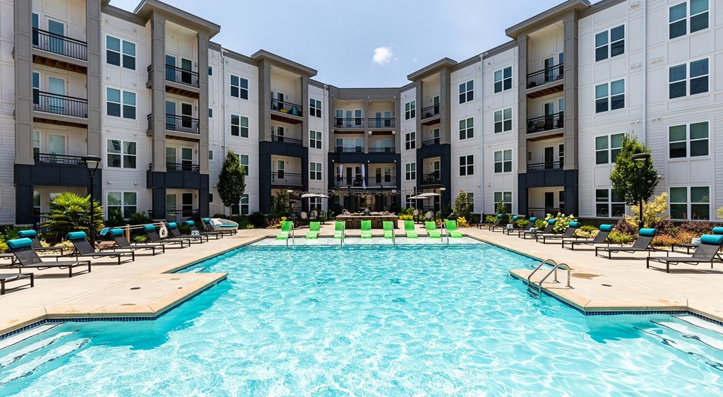 Saltwater pool with aqua sunshelf and sundeck at Berkshire Ballantyne apartments