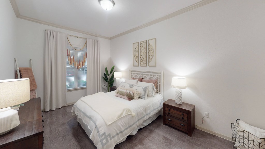 a bedroom with a bed and two night stands