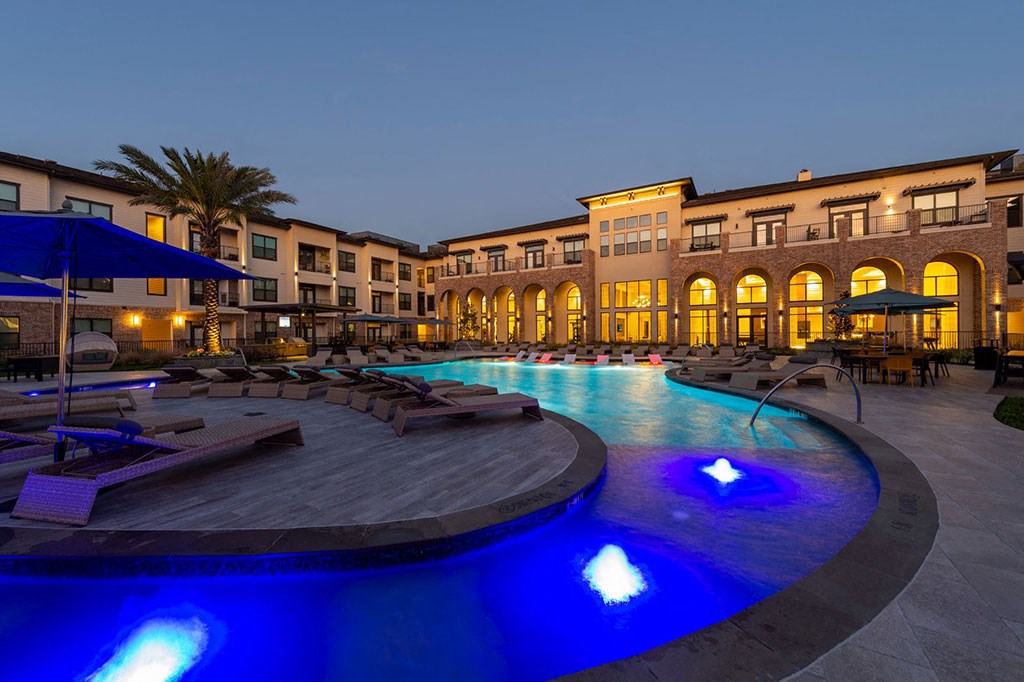 Swimming Pool with Lounge Seating at Berkshire Exchange Apartments, Spring, TX, 77388