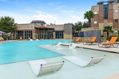 Soho Parkway apartments resort-inspired swimming pool with tanning shelf