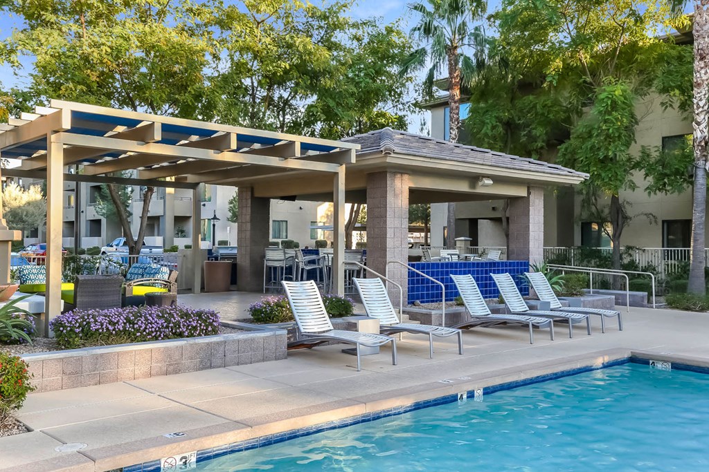 Avora apartments swimming pool with poolside lounging