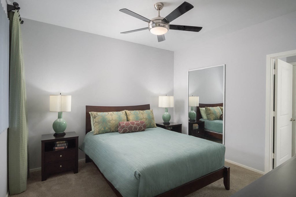 Avora apartments spacious bedroom with ceiling fan