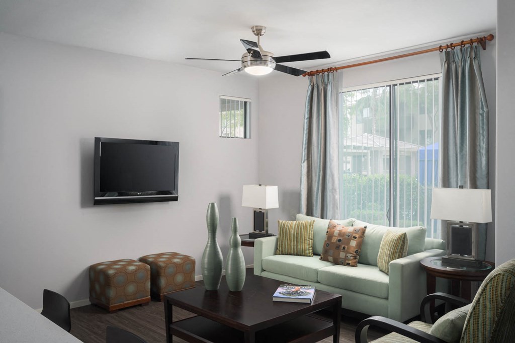 Avora apartments living room with ceiling fan