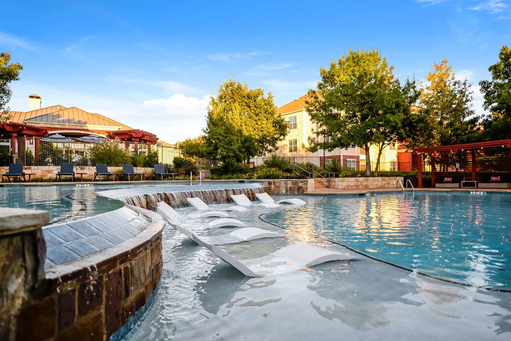 City North at Sunrise Ranch apartments swimming pool with sun tanning shelf