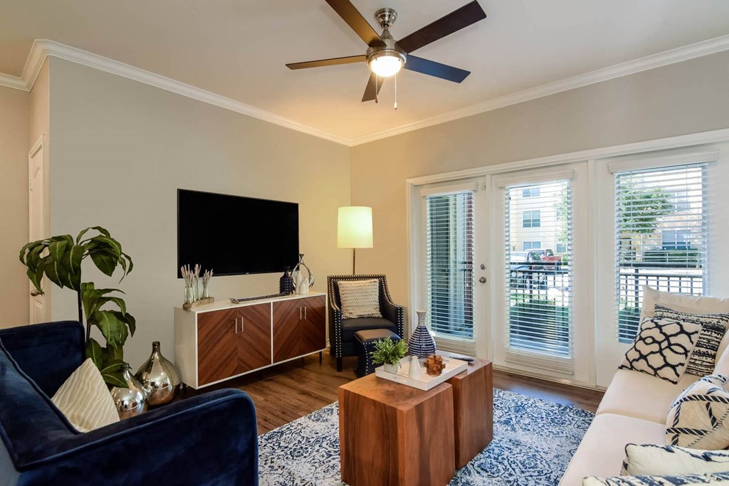 City North at Sunrise Ranch apartments living room with ceiling fan