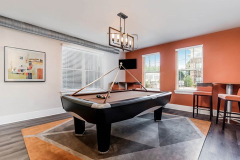 Village at Marquee Station apartments social area with billiards