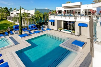 Pure Living apartments swimming pool and lounging area - Photo Gallery 4