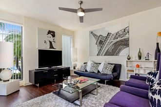 Pure Living apartments living room with ceiling fan