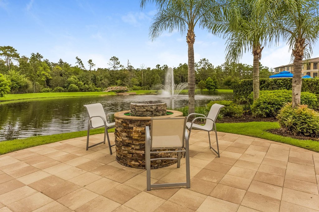 Reserves at Alafaya apartments outdoor lakeside lounging area