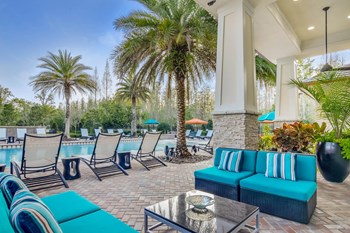 Grand at Cypress Cove apartments outdoor social gathering spaces - Photo Gallery 5