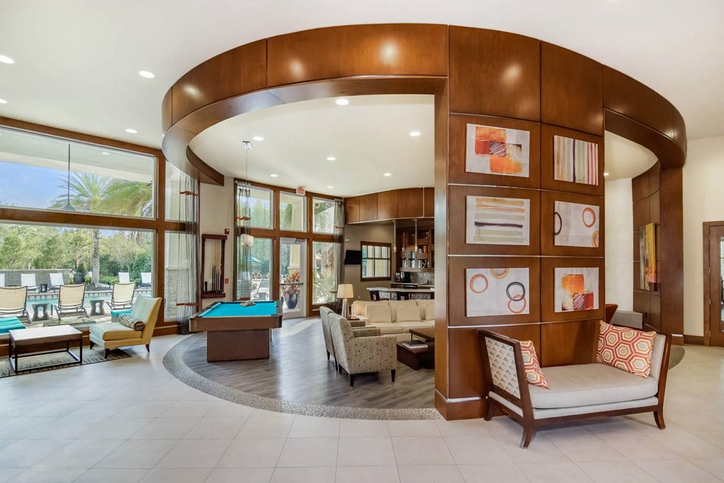 Grand at Cypress Cove apartments social lounge with comfortable seating
