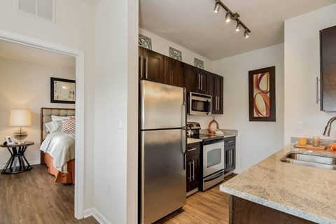 a kitchen with stainless steel appliances and a counter top