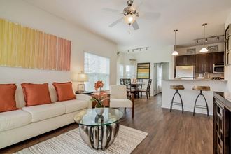 Grand at Cypress Cove apartments living room with ceiling fan