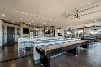 Views at Coolray Field apartments game room social area - Photo Gallery 9