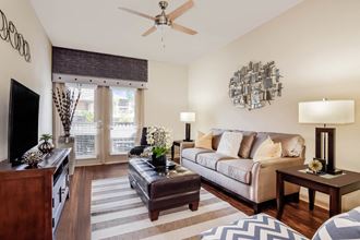 Verano apartments living room with ceiling fan
