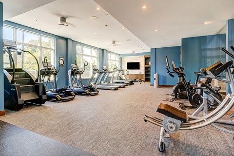 A spacious gym with a variety of exercise equipment.
