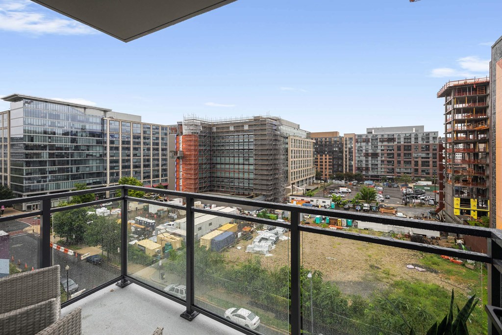 a balcony with a glass railing at Tribeca NOMA apartments