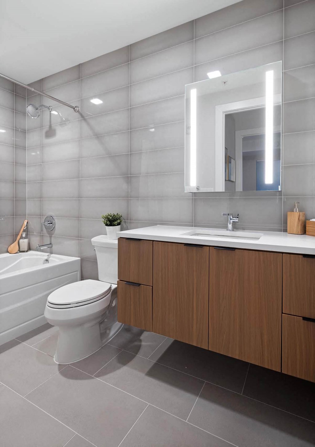 a bathroom with a toilet sink and shower in Tribeca NOMA apartments