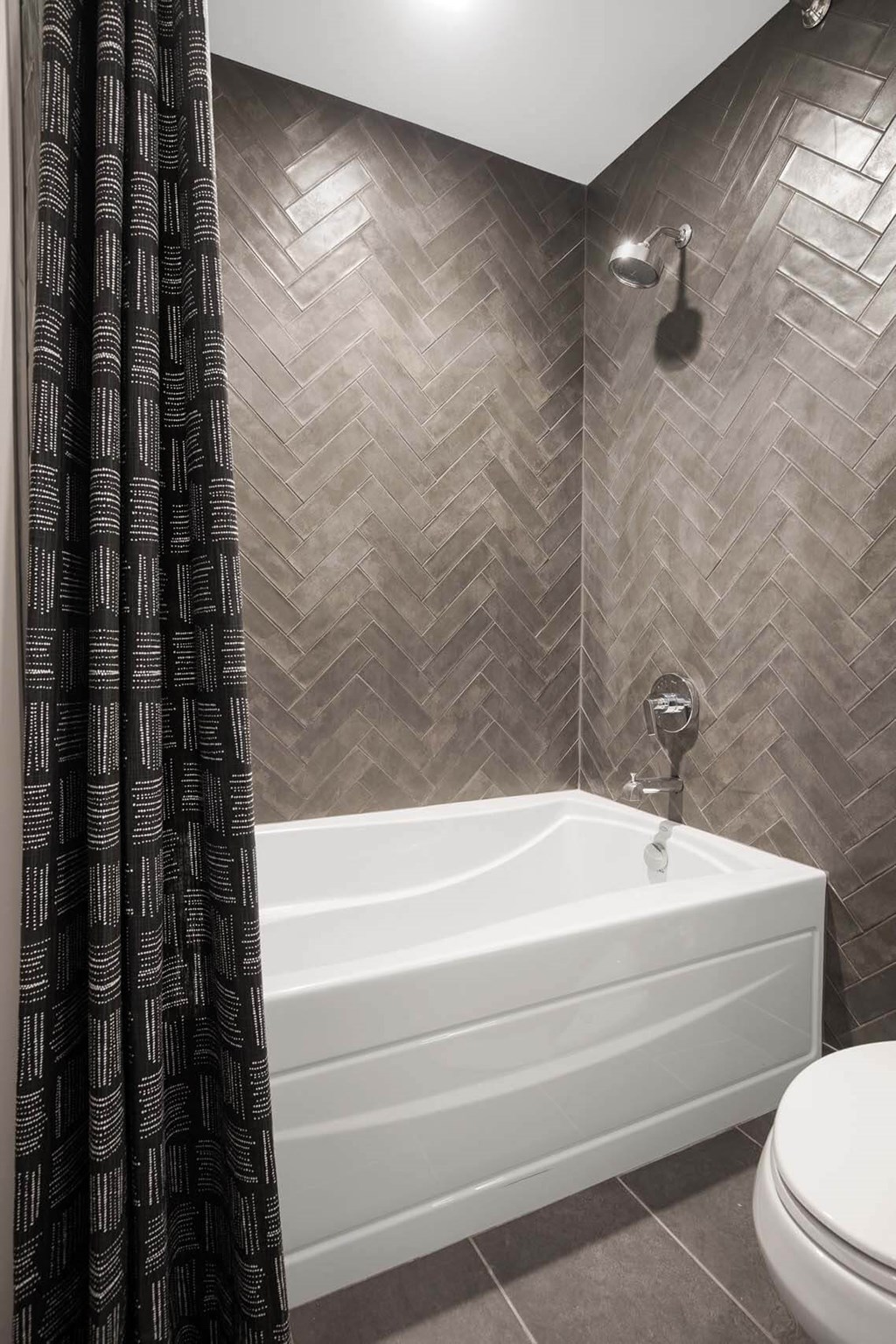a bathroom with a tub and a shower at Tribeca NOMA apartments