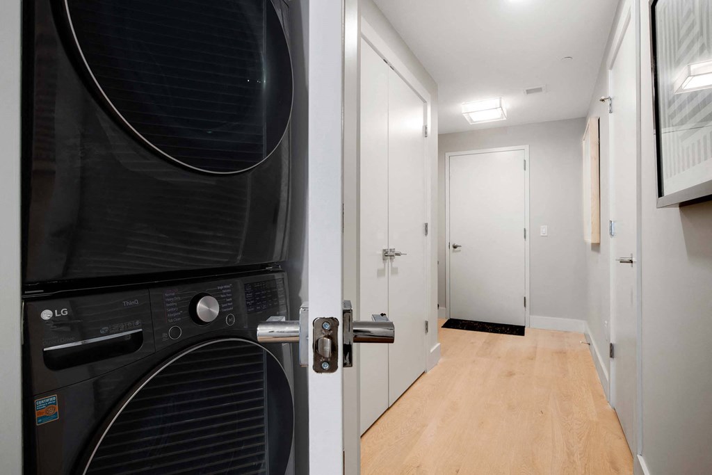 an in unit black washer and dryer at Tribeca NOMA apartments