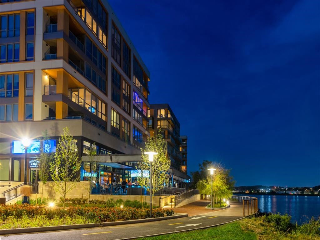 RiverPoint apartments in Washington, DC night view of the waterfront side of building
