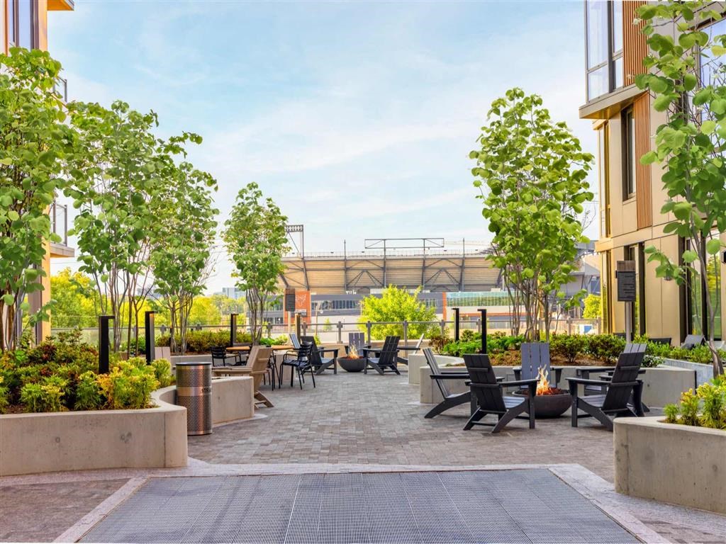 RiverPoint apartments courtyard with fireside lounging and views of DC United pro soccer stadium